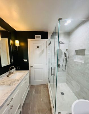 Bathroom Remodel - This remodel was completed on a 1960 bathroom that had multiple layers of tiles existing on the walls and floor.
