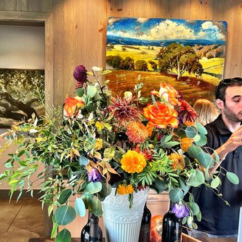 Robert Young Estate Winery - Inside the tasting room - our pourer, Harry, and a gorgeous bouquet - Wineries Near Me - Geyserville, California Robert Young Estate Winery - Inside the tasting room - our pourer, Harry, and a gorgeous bouquet - Wineries Near Me - Geyserville, California