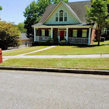 Willing 2 Work - a house in a residential neighborhood - Lawn Services Near Me