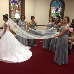 Davids Bridal dress with a body suit purchased at another boutique. Hoop skirt worn under the dress for a fuller effect.