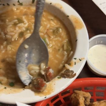 Bayou Crawfish Restaurant - My moms 3 tiny tiny extremely brown crawfish tails out of her bowl of etouffee - Cajun/Creole Near Me - Many, Louisiana