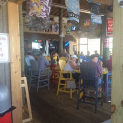 Capt. Andy's Oceanfront Bar & Grill - Many beers on tap and TV for sports right on the beach