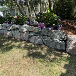 Renovatio Landscape & Design - Gun Metal boulder wall