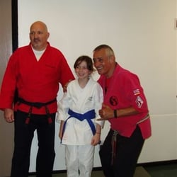 Lathrop Martial Arts - Senior Grand Master Rick Alemany and Sensei Mark Cameron Congratulate Elizabeth Russell on a great job.