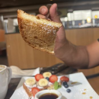 Vees Cafe - French toast with only powder sugar and fruit. How I know French toast to be is to be dipped in egg and cinnamon/milk before cooking.... - Cafes Near Me - Los Angeles, California