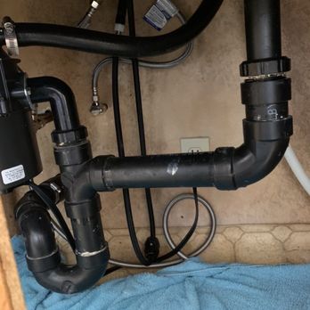 EAVA Drains - The large green towel was used to soak up the standing water from the leaking in the Kitchen Faucet. - Plumbing Near Me EAVA Drains - The large green towel was used to soak up the standing water from the leaking in the Kitchen Faucet. - Plumbing Near Me