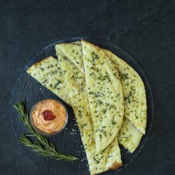 SPIN! Pizza - Flatbread with Red Pepper & Goat Cheese spread.