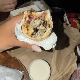 Beef Shawarma wrap. We couldn't wait. It smelled too damn delicious and it sure was. Beef Shawarma wrap. We couldn't wait. It smelled too damn delicious and it sure was.