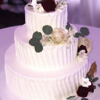 It's All About The Cake - Our wedding cake...look at the details and the right side, our boxer taking a "bite" haha! - Bakeries Near Me - Dana Point, California It's All About The Cake - Our wedding cake...look at the details and the right side, our boxer taking a "bite" haha! - Bakeries Near Me - Dana Point, California