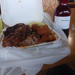 Tastees Jamaican Cuisine - Jerk chicken with rice and peas and cabbage and plantains.