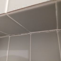 Cracked grout within a week of completion and no usage of the shower. Cracked grout within a week of completion and no usage of the shower.