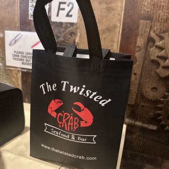 The Twisted Crab - Cute lil to-go bag - Seafood Near Me - Norfolk, Virginia