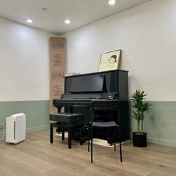 Practice Queens Music Studio - Music instruction room with a high end Yamaha Upright piano.