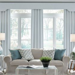 Blinds by Design - Custom drapery installation in Falmouth, Maine. These tailored panels add warmth, softness, and a finished look to the space while improving