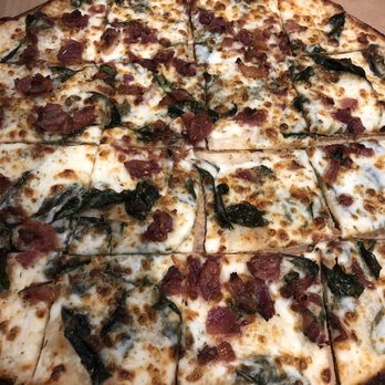 Domino's Pizza - A thin-crust spinach bacon Alfredo pizza. Better than my wife or I were expecting. It's almost gone now. We couldn't help ourselves. - Pizza Near Me - Kansas City, Missouri Domino's Pizza - A thin-crust spinach bacon Alfredo pizza. Better than my wife or I were expecting. It's almost gone now. We couldn't help ourselves. - Pizza Near Me - Kansas City, Missouri