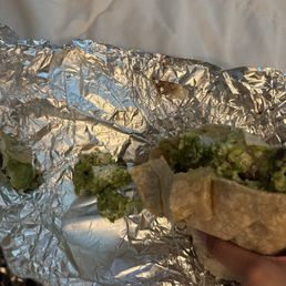 ton of guac, thrown in burrito. guy sounded nervous handing it to me too lol. wtf...