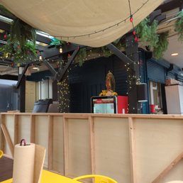 the interior of a restaurant with tables and chairs