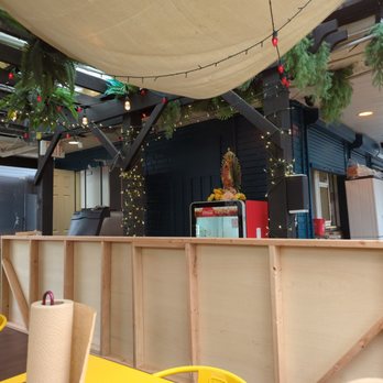 Hola - the interior of a restaurant with tables and chairs - Tacos Near Me - Lakewood, Ohio