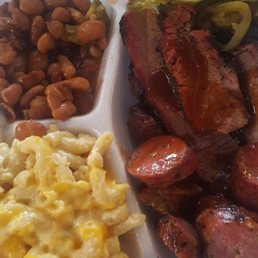 Brisket and sausage with beans and mac. Brisket and sausage with beans and mac.
