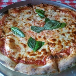Margherita Pizza: Tomato sauce, mozzarella, oregano & basil