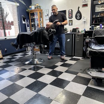 Capitol City Barbershop - Oscar drying the beard after removing a war towel. - Barbers Near Me - Austin, Texas Capitol City Barbershop - Oscar drying the beard after removing a war towel. - Barbers Near Me - Austin, Texas