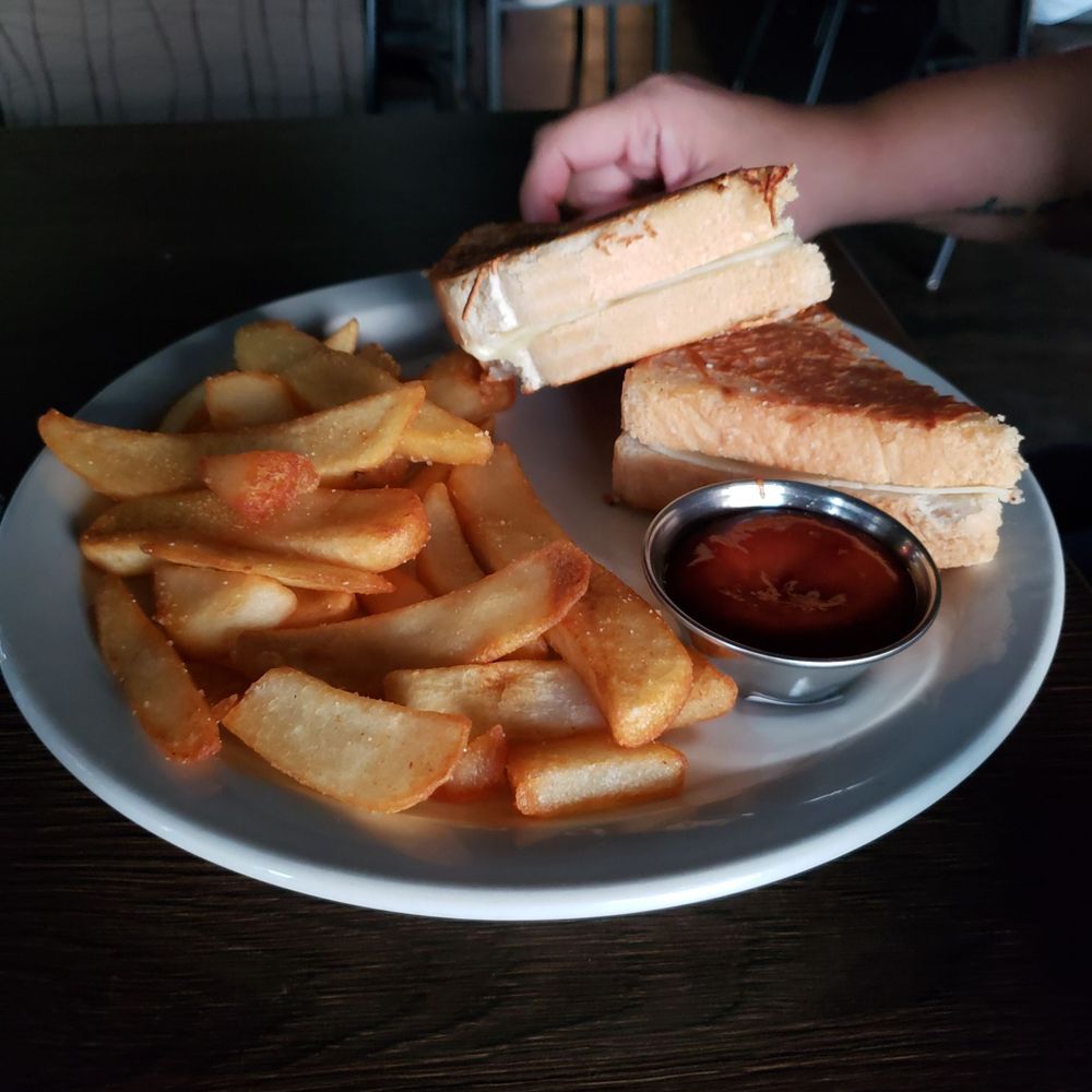 Doyle's Pub - a plate of french fries and a grilled cheese sandwich - Pubs Near Me - Edmonton, Alberta Doyle's Pub - a plate of french fries and a grilled cheese sandwich - Pubs Near Me - Edmonton, Alberta