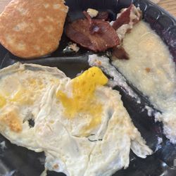 The Caf - Delicious biscuit(very runny, unsalted gravy), perfectly cooked bacon(but crazy salty), undercooked grits with zero salt/butter, cold eggs.