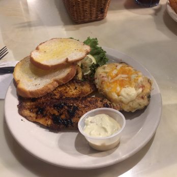 Bones Lounge & Restaurant - Grilled tilapia with twice baked potato - Nightlife Near Me - Jefferson City, Missouri