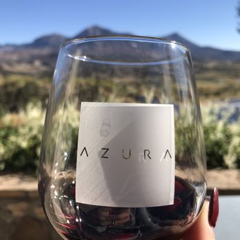 Azura Cellars - a hand holding a glass of wine - Wineries Near Me - Paonia, Colorado Azura Cellars - a hand holding a glass of wine - Wineries Near Me - Paonia, Colorado