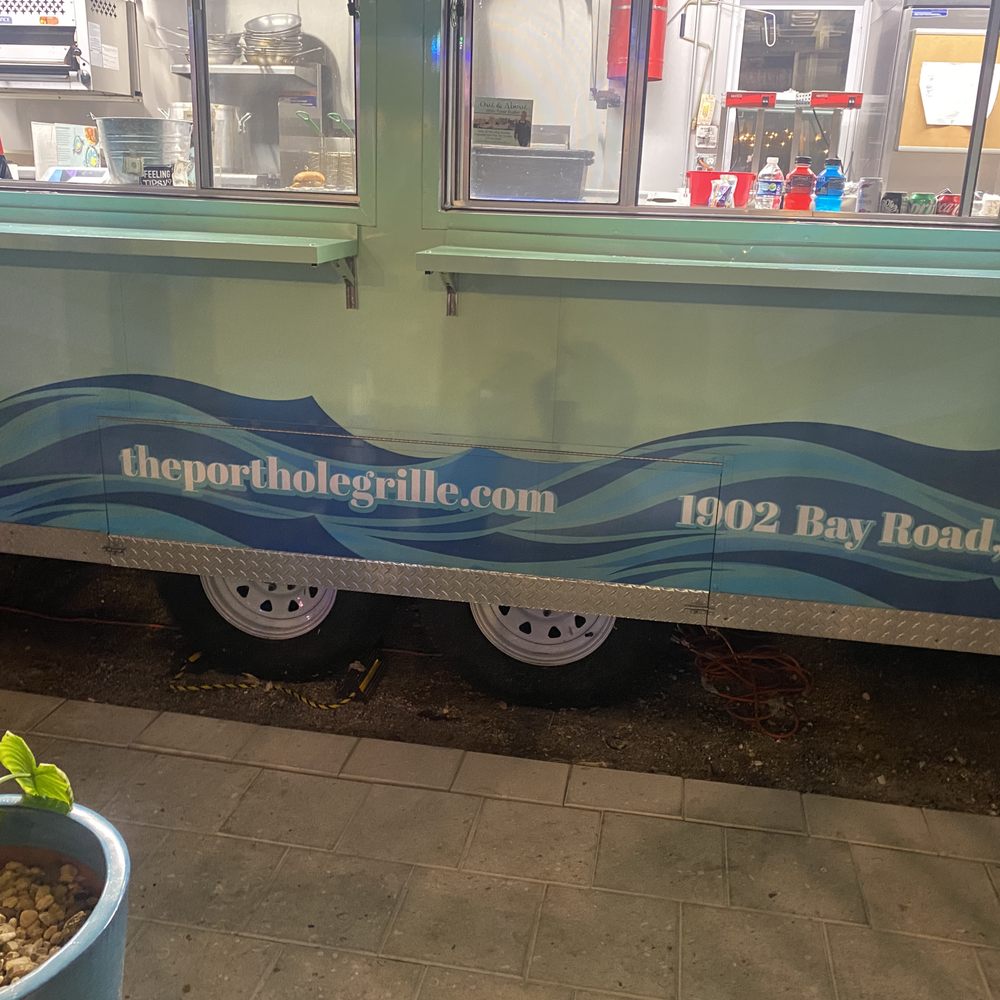 The Porthole Grille - the side of a food truck - Food Trucks Near Me - Sarasota, Florida The Porthole Grille - the side of a food truck - Food Trucks Near Me - Sarasota, Florida