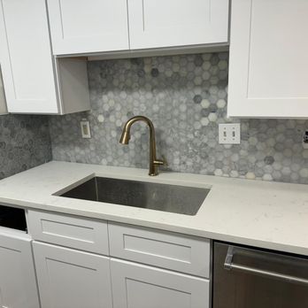 Sunset Emerald Flooring - a kitchen with a sink and dishwasher - Flooring Near Me Sunset Emerald Flooring - a kitchen with a sink and dishwasher - Flooring Near Me