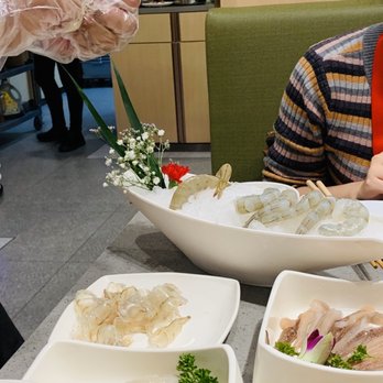 Haidilao Hotpot Flushing - Shelling of shrimp and then a seperate fishcake stuffing was provided for us. - Hot Pot Near Me - Flushing, New York Haidilao Hotpot Flushing - Shelling of shrimp and then a seperate fishcake stuffing was provided for us. - Hot Pot Near Me - Flushing, New York