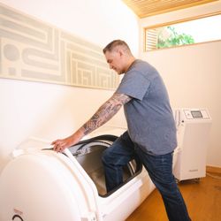 Essential Medicine - Client getting into Hyperbaric Oxygen Chamber for a nap.