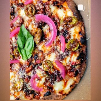 JoeyParm's Pizza - a close up of a pizza - Pizza Near Me - Denver, Colorado JoeyParm's Pizza - a close up of a pizza - Pizza Near Me - Denver, Colorado