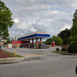 Murphy USA - Outside. There's a tiny convenience store and 8 pumps on-site. There's also an ATM and pay machines with air for your tires and vacuums.