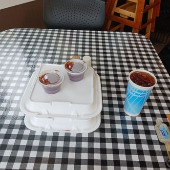 Rhodie's Smokin BBQ - a tray of ketchup and two cups of ketchup on a table - Barbeque Near Me - Issaquah, Washington Rhodie's Smokin BBQ - a tray of ketchup and two cups of ketchup on a table - Barbeque Near Me - Issaquah, Washington