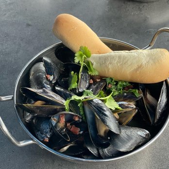 Dead Eye Dick's - 'Hi Neighbor' Mussels: Narragansett Lager-steamed mussels with chorizo, white beans, fennel, lemon, cilantro, and dipping bread - New American Near Me - Block Island, Rhode Island Dead Eye Dick's - 'Hi Neighbor' Mussels: Narragansett Lager-steamed mussels with chorizo, white beans, fennel, lemon, cilantro, and dipping bread - New American Near Me - Block Island, Rhode Island