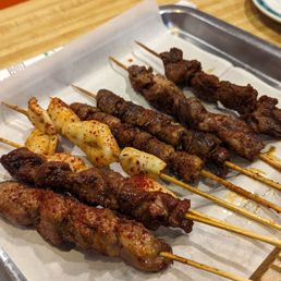 Lamb, squid, chicken heart, beef skewers. All very good but beef and lamb is best Lamb, squid, chicken heart, beef skewers. All very good but beef and lamb is best