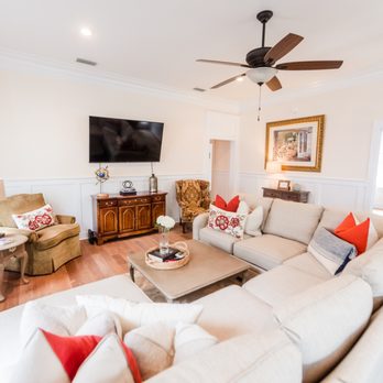 1702 Real Estate - a living room with a ceiling fan - Real Estate Services Near Me - Mobile, Alabama