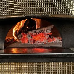 Livello - Real wood burning oven makes food taste even more phenomenal!