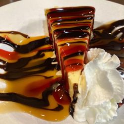 Valerie’s Fine Dining - Cheesecake with caramel and chocolate drizzle