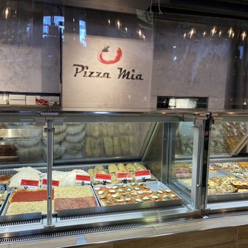 Pizza Mia - a variety of pizzas in a display case - Italian Near Me - Montreal, Quebec Pizza Mia - a variety of pizzas in a display case - Italian Near Me - Montreal, Quebec