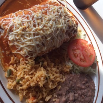Los Compadres Taqueria - Chicken burrito suizo with rice and beans - very tasty and approximately the size of my head! - Mexican Near Me - Mount Prospect, Illinois Los Compadres Taqueria - Chicken burrito suizo with rice and beans - very tasty and approximately the size of my head! - Mexican Near Me - Mount Prospect, Illinois