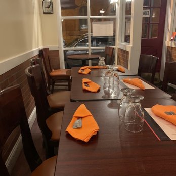 Jasmine Rice - Rittenhouse - a long table with orange napkins - Thai Near Me - Philadelphia, Pennsylvania Jasmine Rice - Rittenhouse - a long table with orange napkins - Thai Near Me - Philadelphia, Pennsylvania