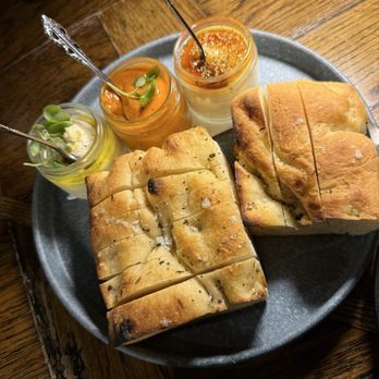 Siena Tavern - Focaccia with tomato romesco , garlic butter, honey ricotta spread - Italian Near Me - Chicago, Illinois Siena Tavern - Focaccia with tomato romesco , garlic butter, honey ricotta spread - Italian Near Me - Chicago, Illinois