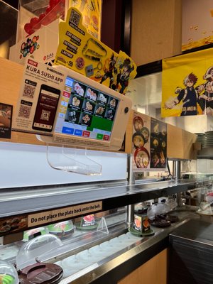 Kura Revolving Sushi Bar by null