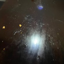 a black counter top with yellow chips on it a black counter top with yellow chips on it
