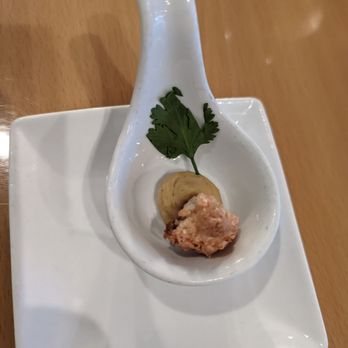 The Fat Snook - In amuse buche consisting of a macaroon and a a curry creme fraiche - Seafood Near Me - Cocoa Beach, Florida The Fat Snook - In amuse buche consisting of a macaroon and a a curry creme fraiche - Seafood Near Me - Cocoa Beach, Florida