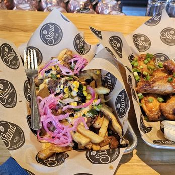 The Stand - American Classics Redefined - The Stand Hefenwisen beer, pulled pork fries and chicken wings - New American Near Me - Santa Clara, California