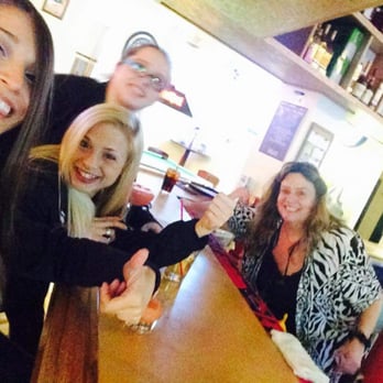 Moosehead Saloon - a group of women sitting at a bar - Pubs Near Me - Palmer, Alaska